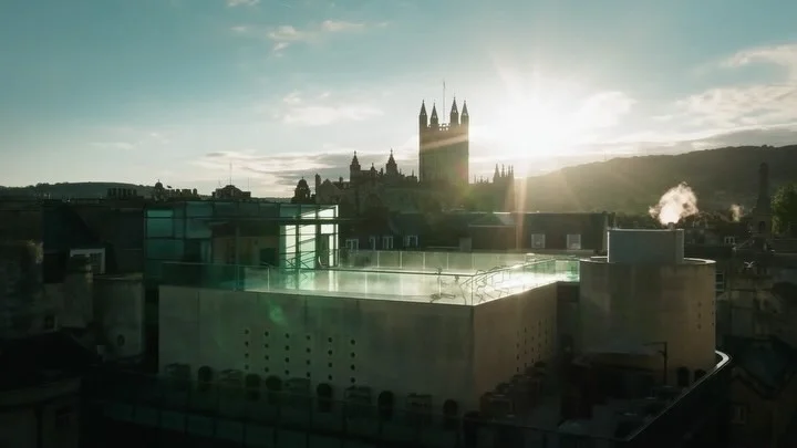 The rooftop pool at Thermae Bath Spa with views over the city of Bath.